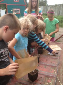 Farm Kids sowing their mystery bags of seeds.